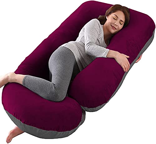 Woman sleeping on a Mom's Moon Pregnancy pillow
